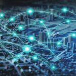 A digital city map overlaid with glowing blue network nodes and signal pathways, illustrating real‑time connectivity patterns and potential outage points across an urban environment.